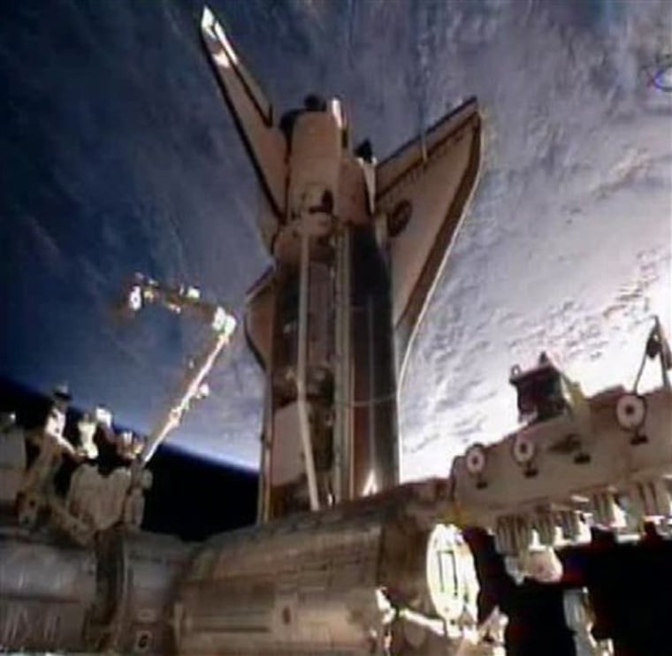 In this frame grab from video taken from NASA television, space shuttle Discovery is seen moments after docking at the International Space Station, its final visit before being parked at a museum, Saturday, Feb. 26, 2011. (AP Photo/NASA)